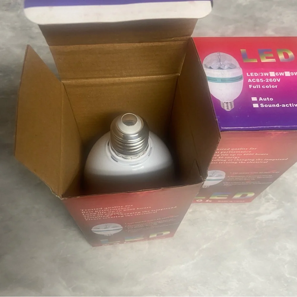 Two (2) pack RGB rotating LED light bulbs NIB